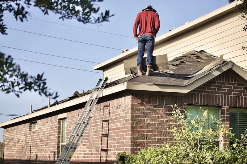 Professional roofer working on a residential roof in Featherstone Shores